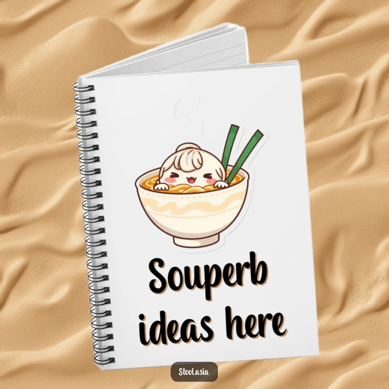 Funny whimsical noodle bowl character peeking from steaming broth on a notebook cover.